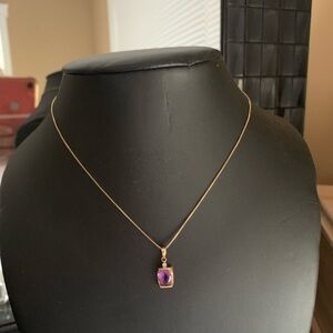 14k pure gold. With Amatista stone